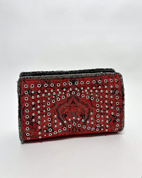 Studded oriental rug clutch bag