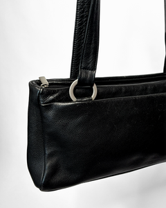 Sleek 90’s minimalism leather bag with silver metal hoops