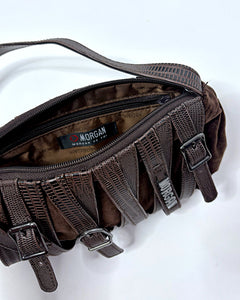 Belt buckles all over baguette bag