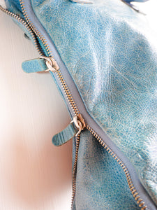 Turquoise side zipper leather bag