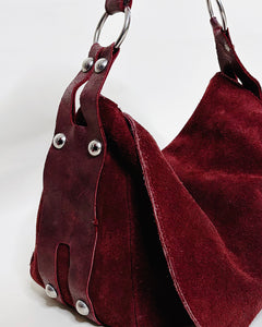 Cherry red studded suede bag