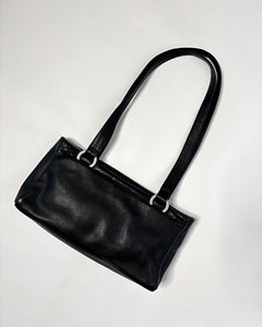Sleek 90’s minimalism leather bag with silver metal hoops