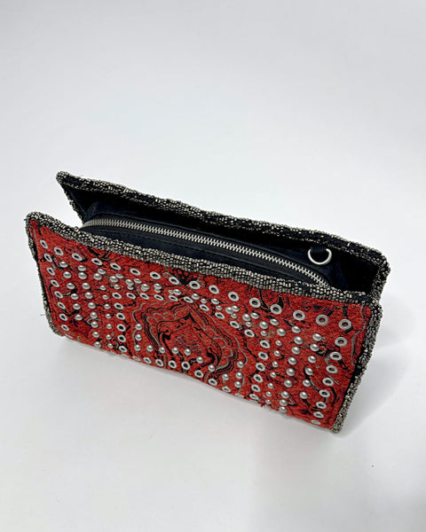 Studded oriental rug clutch bag