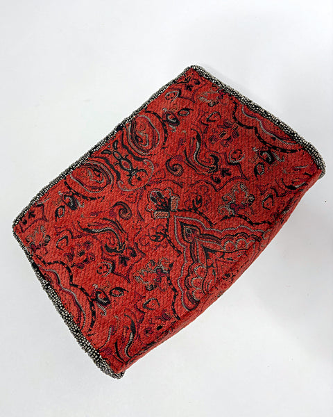 Studded oriental rug clutch bag