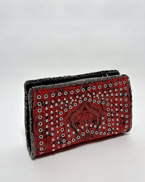 Studded oriental rug clutch bag