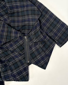 Plaid asymmetric peplum top