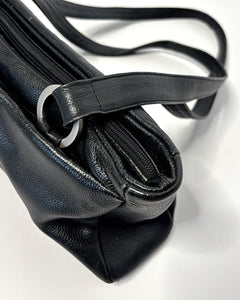 Sleek 90’s minimalism leather bag with silver metal hoops