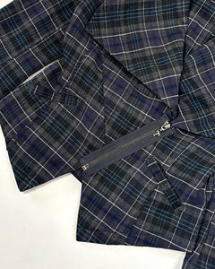 Plaid asymmetric peplum top
