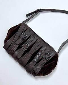 Belt buckles all over baguette bag
