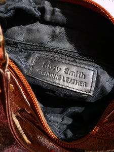 Metallic studded leather bag