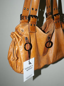 Brown leather buckle bag